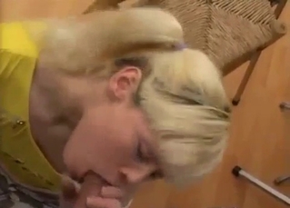 Blond-haired teen sucking daddy's dick